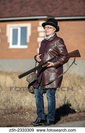 Stock Photo - Hunting rifle, a means of self-defense.. Fotosearch