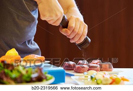 Kitchen. Healthy eating. Healthy growth. Season the fish. View Large Photo Image Stock Photograph - Kitchen. Healthy eating. Healthy growth. Season the fish.. Fotosearch