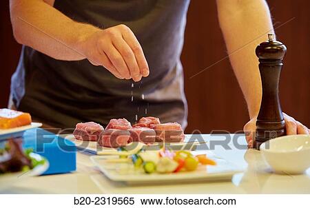 Kitchen. Healthy eating. Healthy growth. Season the fish. View Large Photo Image Stock Photography - Kitchen. Healthy eating. Healthy growth. Season the fish.. Fotosearch