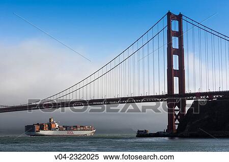 Large container ship passing under the Golden Gate Bridge, San Francisco, California, USA View Large Photo Image Stock Photography - Large container ship passing under the Golden Gate Bridge, San Francisco, California, USA. Fotosearch