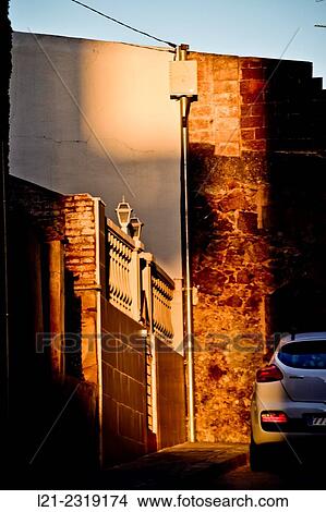 Last rays of the sun on a balcony and wall. Barcelona, Catalonia, Spain. View Large Photo Image Picture - Last rays of the sun on a balcony and wall. Barcelona, Catalonia, Spain.. Fotosearch