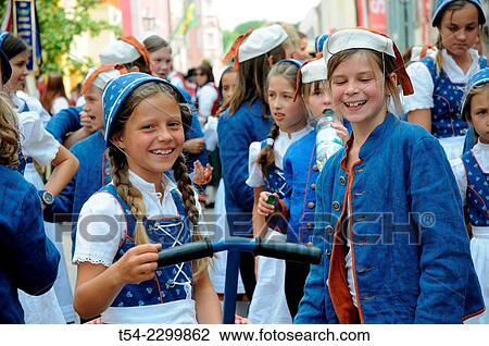 Stock Image - Laughing girl in folk costumes on the children's festival in Memmingen, Bavaria, Germany. Fotosearch