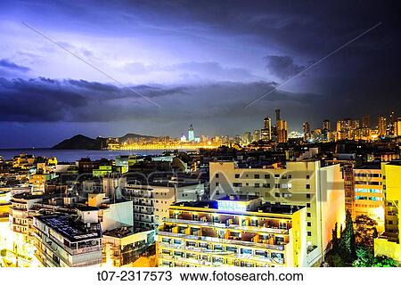 Midtown of Benidorm during thunder storm, Province of Alicante, Costa Blanca, Western Mediterranean Sea, Southern Spain. View Large Photo Image Stock Image - Midtown of Benidorm during thunder storm, Province of Alicante, Costa Blanca, Western Mediterranean Sea, Southern Spain.. Fotosearch