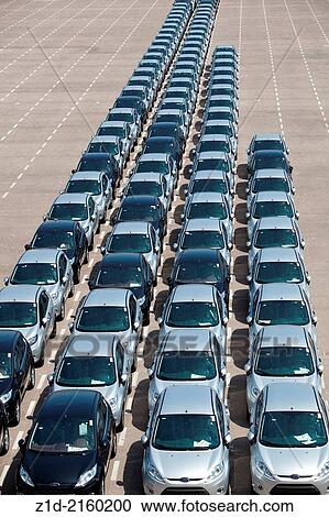 New cars being unloaded and parked on quayside of the port of Valencia Spain. View Large Photo Image Stock Image - New cars being unloaded and parked on quayside of the port of Valencia Spain.. Fotosearch
