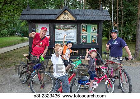 Polish/American family of three generations celebrating bicycle ride through the National Forest. Spala Central Poland. View Large Photo Image Stock Photograph - Polish/American family of three generations celebrating bicycle ride through the National Forest. Spala Central Poland.. Fotosearch