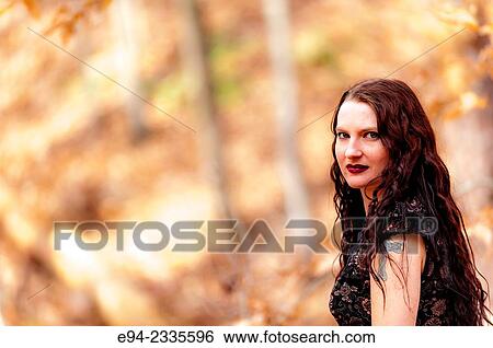 Portrait of a 33 year old brunette woman outdoors. View Large Photo Image Stock Photograph - Portrait of a 33 year old brunette woman outdoors.. Fotosearch