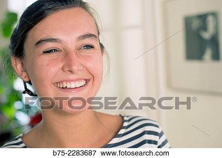 Portrait of young woman smiling, happy and joy View Large Photo Image Stock Photo - Portrait of young woman smiling, happy and joy. Fotosearch
