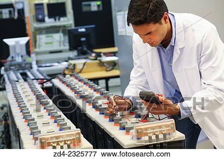 Researcher performing a battery test. Classic Solar Batteries. Solar Liquid Cell. Technological research on energy. Energy and Environment. Tecnalia Research & innovation, Bizkaia, Basque Country, Spain View Large Photo Image Stock Photo - Researcher performing a battery test. Classic Solar Batteries. Solar Liquid Cell. Technological research on energy. Energy and Environment. Tecnalia Research & innovation, Bizkaia, Basque Country, Spain. Fotosearch