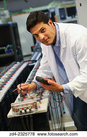 Stock Photo - Researcher performing a battery test. Classic Solar Batteries. Solar Liquid Cell. Technological research on energy. Energy and Environment. Tecnalia Research & innovation, Bizkaia, Basque Country, Spain. Fotosearch