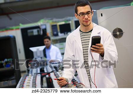 Stock Photo - Researcher performing a battery test. Classic Solar Batteries. Solar Liquid Cell. Technological research on energy. Energy and Environment. Tecnalia Research & innovation, Bizkaia, Basque Country, Spain. Fotosearch