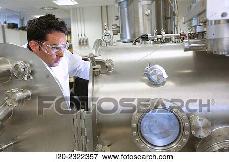 Stock Photo - Researcher. Vacuum chamber for tribological measurements. Laboratory surfaces. Tecnalia Research and Innovation. Donostia. San Sebastian. Gipuzkoa. Basque Country. Spain. Europe.. Fotosearch