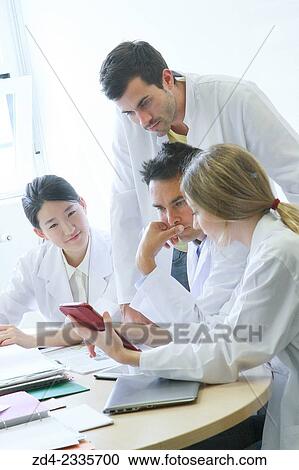 Stock Image - Researchers in meeting room. Technological Services to Industry. Tecnalia Research & Innovation, Donostia, San Sebastian, Gipuzkoa, Basque Country, Spain.. Fotosearch