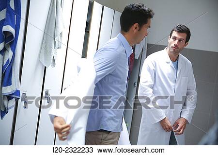 Stock Image - Researchers in the dressing room. White coats. Technological Services to Industry. Tecnalia Research & Innovation, Donostia, San Sebastian, Gipuzkoa, Basque Country, Spain.. Fotosearch