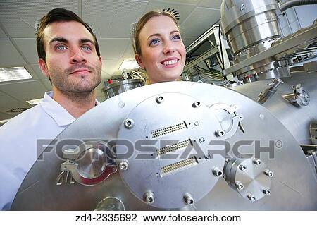 Stock Image - Researchers. Vacuum chamber for tribological measurements. Laboratory surfaces. Tecnalia Research and Innovation. Donostia. San Sebastian. Gipuzkoa. Basque Country. Spain. Fotosearch