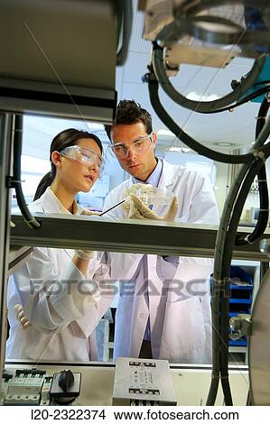 Picture - Researchers. Vacuum chamber microwave plasma. Laboratory surfaces. Tecnalia Research and Innovation. Donostia. San Sebastian. Gipuzkoa. Basque Country. Spain. Europe.. Fotosearch