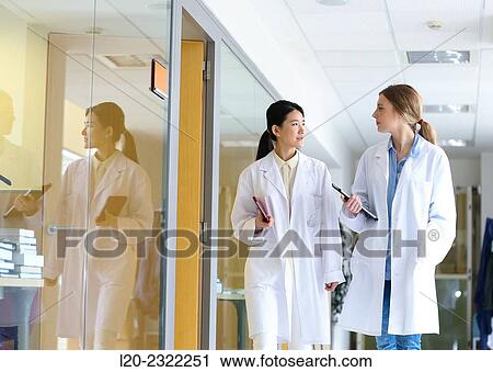 Stock Image - Researchers walking in hallway laboratory. Chemical Analysis Laboratory. Technological Services to Industry. Tecnalia Research & Innovation, Donostia, San Sebastian, Gipuzkoa, Basque Country, Spain.. Fotosearch