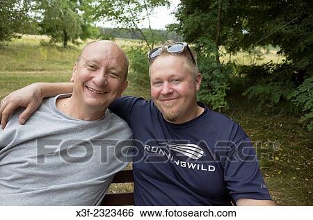 Respectful son-in-law has arm around his fun loving Polish pop. Zawady Central Poland. View Large Photo Image Stock Photograph - Respectful son-in-law has arm around his fun loving Polish pop. Zawady Central Poland.. Fotosearch