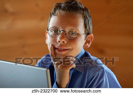 Schoolboy is studying laptop. View Large Photo Image Stock Image - Schoolboy is studying laptop.. Fotosearch
