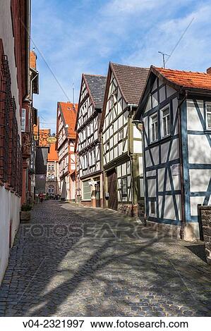 Small alley with traditional houses in Alsfeld on the German Fairy Tale Route, Hesse, Germany, Europe View Large Photo Image Stock Photo - Small alley with traditional houses in Alsfeld on the German Fairy Tale Route, Hesse, Germany, Europe. Fotosearch