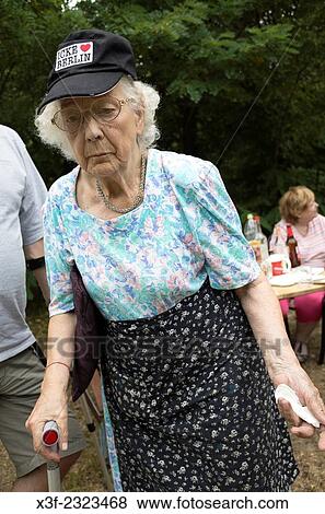 Sporty Polish great grandmother age 88 walks with cane at family picnic. Zawady Central Poland. View Large Photo Image Stock Photo - Sporty Polish great grandmother age 88 walks with cane at family picnic. Zawady Central Poland.. Fotosearch