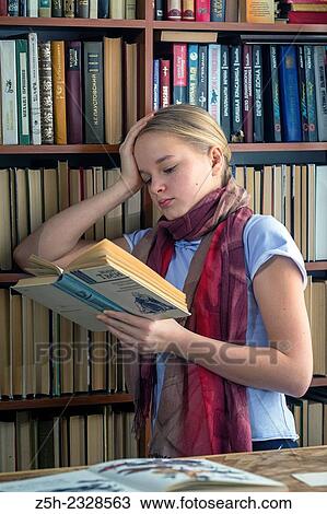 The girl with green apple and a book. View Large Photo Image Stock Image - The girl with green apple and a book.. Fotosearch