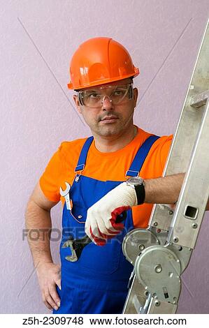 Stock Photo - The installer performs the order.. Fotosearch