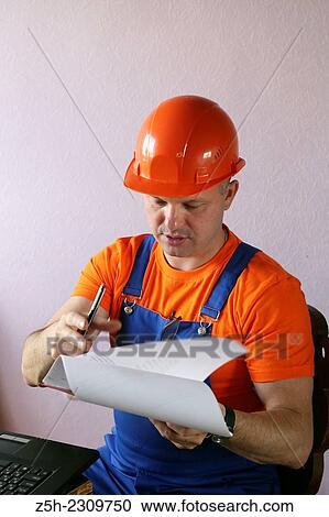 The man, the builder of residential homes. View Large Photo Image Stock Image - The man, the builder of residential homes.. Fotosearch