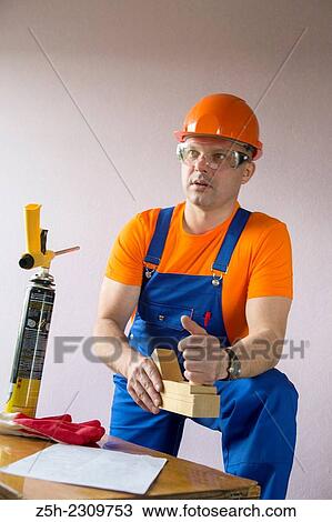 The man, the builder of residential homes. View Large Photo Image Stock Image - The man, the builder of residential homes.. Fotosearch