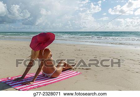 Usa. Florida. Miami Beach. Young woman on the beach View Large Photo Image Stock Image - Usa. Florida. Miami Beach. Young woman on the beach. Fotosearch