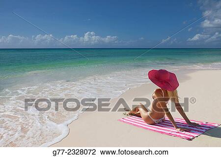 Usa. Florida. Miami Beach. Young woman on the beach View Large Photo Image Stock Image - Usa. Florida. Miami Beach. Young woman on the beach. Fotosearch