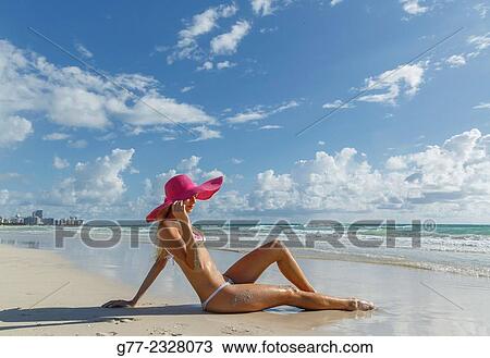 Usa. Florida. Miami Beach. Young woman on the beach View Large Photo Image Stock Image - Usa. Florida. Miami Beach. Young woman on the beach. Fotosearch