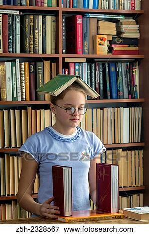 Young girl reading fiction. View Large Photo Image Stock Photo - Young girl reading fiction.. Fotosearch