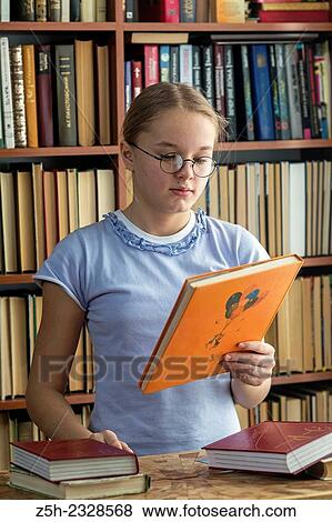 Young girl reading fiction. View Large Photo Image Stock Photo - Young girl reading fiction.. Fotosearch