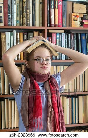 Young girl reading fiction. View Large Photo Image Stock Photography - Young girl reading fiction.. Fotosearch