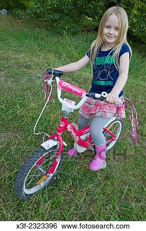 Young Polish girl age 6 on her decorated fancy bicycle. Zawady Central Poland. View Large Photo Image Stock Photograph - Young Polish girl age 6 on her decorated fancy bicycle. Zawady Central Poland.. Fotosearch