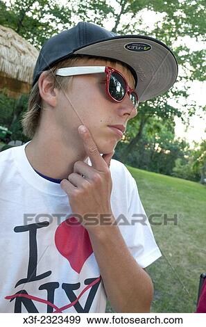 Young teen boy wearing a I Love NY t-shirt Clitherall Minnesota MN USA. View Large Photo Image Stock Photo - Young teen boy wearing a I Love NY t-shirt Clitherall Minnesota MN USA.. Fotosearch