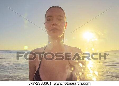 Stock Image - young woman in the sea.. Fotosearch