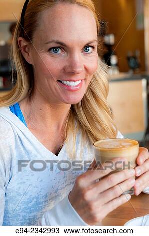 Stock Image - 39 year old blond woman wearing fitness clothing.. Fotosearch