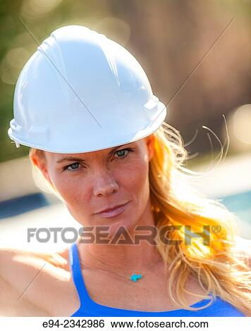 39 year old blond woman wearing fitness clothing and a white hard hat. View Large Photo Image Stock Photograph - 39 year old blond woman wearing fitness clothing and a white hard hat.. Fotosearch