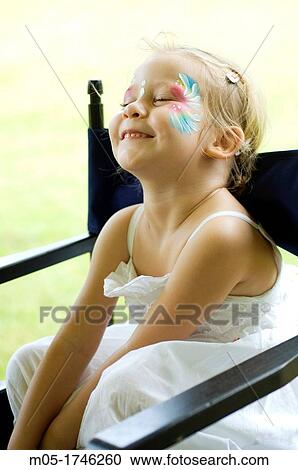 A 4 year girl having a face painting View Large Photo Image Stock Image - A 4 year girl having a face painting. Fotosearch