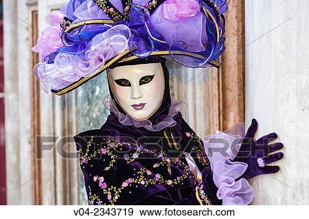 Stock Photo - A masked woman at the carnival in Venice, Italy, Europe. Fotosearch