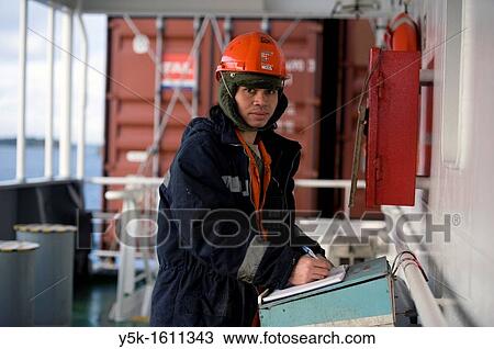 An Indonesian seaman or sailor on the container-vessel MV Flintercape, during a journey from Rotterdam, Netherlands, to Sundsvall, Sweden. View Large Photo Image Stock Image - An Indonesian seaman or sailor on the container-vessel MV Flintercape, during a journey from Rotterdam, Netherlands, to Sundsvall, Sweden.. Fotosearch