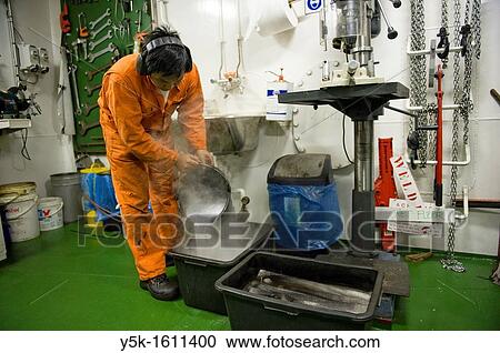 An Indonesian seaman or sailor on the container-vessel MV Flintercape, during a journey from Rotterdam, Netherlands, to Sundsvall, Sweden. View Large Photo Image Stock Image - An Indonesian seaman or sailor on the container-vessel MV Flintercape, during a journey from Rotterdam, Netherlands, to Sundsvall, Sweden.. Fotosearch