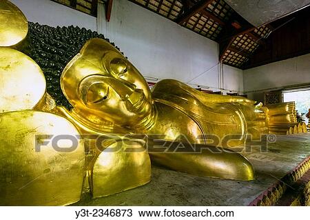 Stock Image - Asia. Thailand, Chiang Mai. Wat Phra Singh. Reclining buddha.. Fotosearch
