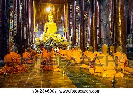 Asia. Thailand, Chiang Mai. Wat Phra Singh. Monks praying. View Large Photo Image Stock Photo - Asia. Thailand, Chiang Mai. Wat Phra Singh. Monks praying.. Fotosearch