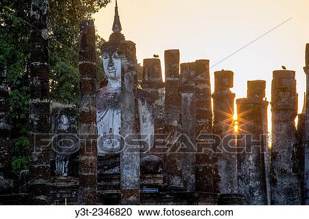 Asia. Thailand, old capital of Siam. Sukhothai archaeological Park, classified UNESCO World Heritage. Wat Mahatat. Buddha statue at sunset. View Large Photo Image Stock Image - Asia. Thailand, old capital of Siam. Sukhothai archaeological Park, classified UNESCO World Heritage. Wat Mahatat. Buddha statue at sunset.. Fotosearch