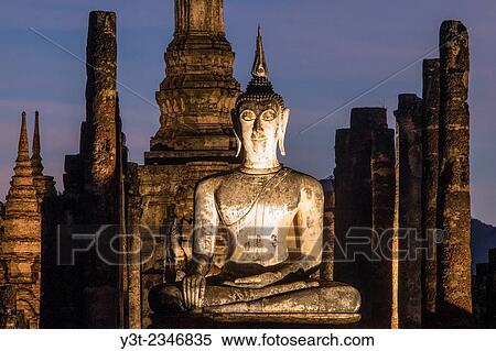 Stock Photography - Asia. Thailand, old capital of Siam. Sukhothai archaeological Park, classified UNESCO World Heritage. Wat Mahatat at sunset.. Fotosearch