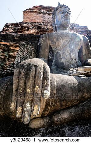 Asia. Thailand, Sukhothai Province. Sukhothai archaeological Park, classified UNESCO World Heritage. Wat Mahatat. Buddha statue. View Large Photo Image Stock Image - Asia. Thailand, Sukhothai Province. Sukhothai archaeological Park, classified UNESCO World Heritage. Wat Mahatat. Buddha statue.. Fotosearch