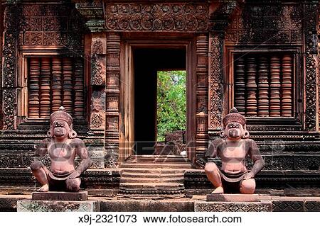 Banteay Srei temple, cntral courtyard with monkey and yaksha guardian figures, siem reap, cambodia. View Large Photo Image Stock Image - Banteay Srei temple, cntral courtyard with monkey and yaksha guardian figures, siem reap, cambodia.. Fotosearch