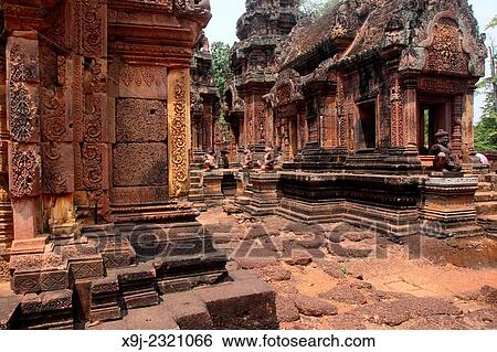 Banteay Srei temple, cntral courtyard with monkey and yaksha guardian figures, siem reap, cambodia. View Large Photo Image Stock Photograph - Banteay Srei temple, cntral courtyard with monkey and yaksha guardian figures, siem reap, cambodia.. Fotosearch